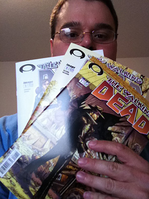 Me holding all three comics that would be valued at around $1,500