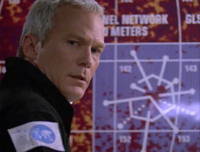 TC McQueen in font of a map of planet Daedalus